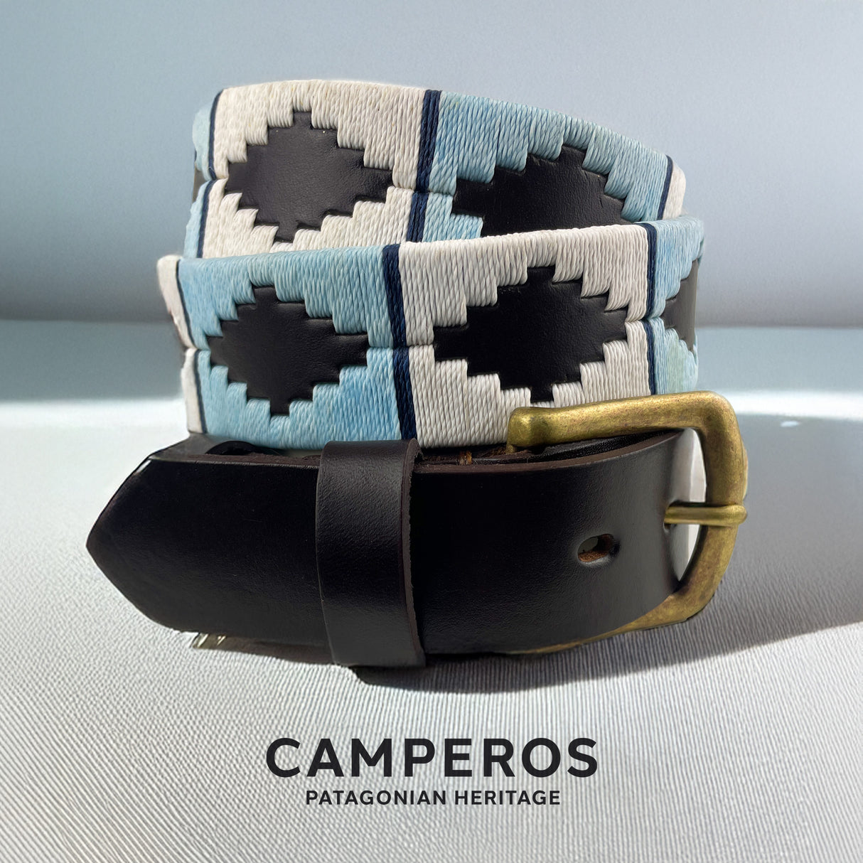 Handcrafted leather polo belt with Blue, White & Light Blue thread embroidery and bronze buckle, by Camperos