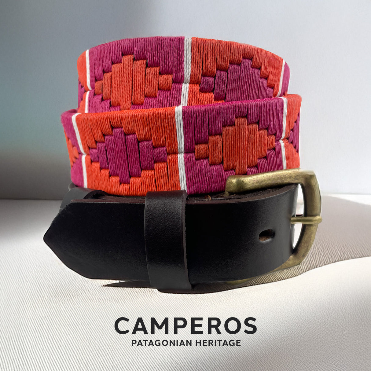 Handcrafted leather polo belt with Orange & Purple thread embroidery and bronze buckle, by Camperos